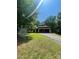 View of home on a wooded lot with an attached two-car garage and a paved driveway at 2505 White Thorne Ln, Waxhaw, NC 28173