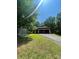 View of home on a wooded lot with an attached two-car garage and a paved driveway at 2505 White Thorne Ln, Waxhaw, NC 28173