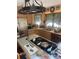 Bright kitchen featuring stainless steel appliances and cooktop island at 2505 White Thorne Ln, Waxhaw, NC 28173
