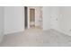 Bedroom showcasing neutral carpeting and an ensuite bathroom at 2512 Cranbrook Ln # 9, Charlotte, NC 28207