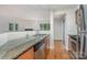 Kitchen featuring granite countertops, stainless steel appliances, and tile backsplash at 2512 Cranbrook Ln # 9, Charlotte, NC 28207
