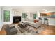 Inviting living room featuring a fireplace, plush seating, and a convenient breakfast bar with stools at 2512 Cranbrook Ln # 9, Charlotte, NC 28207