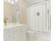 Bright bathroom featuring a white vanity, framed mirror, and a shower/tub combination with clean lines at 2516 Selwyn Ave, Charlotte, NC 28209