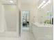 Bathroom showcasing a single vanity, walk-in shower and view into the bedroom at 2516 Selwyn Ave, Charlotte, NC 28209