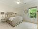 Bedroom with natural light, double closets and simple decor creating a serene atmosphere at 2516 Selwyn Ave, Charlotte, NC 28209