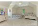 Bright bedroom with ceiling fan, two beds, natural light, and charming decor at 2516 Selwyn Ave, Charlotte, NC 28209