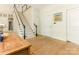 Welcoming foyer featuring hardwood floors, a staircase, and access to the kitchen and other living areas at 2516 Selwyn Ave, Charlotte, NC 28209