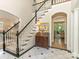 View of the foyer showing a staircase, marble floors and a glimpse of a living room at 2516 Selwyn Ave, Charlotte, NC 28209
