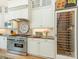 Gourmet kitchen with stainless steel appliances, custom cabinets, and wine storage at 2516 Selwyn Ave, Charlotte, NC 28209