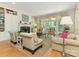 View of a bright and comfortable living room with a fireplace, sofa and lots of natural light at 2516 Selwyn Ave, Charlotte, NC 28209