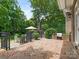 Brick patio with outdoor seating, built-in grill, and a charming brick fireplace for entertaining at 2516 Selwyn Ave, Charlotte, NC 28209