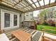 Enjoyable back deck leads to a well-maintained lawn with a charming fire pit area at 2518 Pinckney Ave, Charlotte, NC 28205