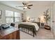 Comfortable bedroom with a ceiling fan, and a large window providing natural light at 2518 Pinckney Ave, Charlotte, NC 28205