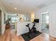 Bonus room with Peloton and open access to the living room and bathroom with modern fixtures at 2518 Pinckney Ave, Charlotte, NC 28205