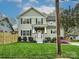 Inviting two-story home featuring manicured lawn, stone accents, and a charming front porch at 2518 Pinckney Ave, Charlotte, NC 28205