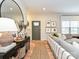 Bright living room with hardwood floors, neutral decor, a decorative mirror, and a cozy seating area at 2518 Pinckney Ave, Charlotte, NC 28205
