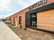 Charlotte Vintage Furniture retail storefront features modern design elements, including a black accent and wooden exterior at 2518 Pinckney Ave, Charlotte, NC 28205