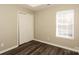 A modern bedroom with a closet, window, and hardwood floors at 2599 April Showers Ln, Rock Hill, SC 29730