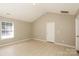 Living room with light-colored tile floor and vaulted ceiling at 2599 April Showers Ln, Rock Hill, SC 29730