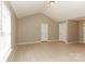 Living room with light-colored tile floor and vaulted ceiling at 2599 April Showers Ln, Rock Hill, SC 29730