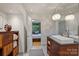 Stylish bathroom with modern lighting, sleek countertop and an adjacent bedroom view at 2600 Cloister Dr, Charlotte, NC 28211