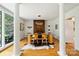 Sunlit dining room featuring hardwood floors, unique lighting, and a glass table at 2600 Cloister Dr, Charlotte, NC 28211