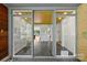 Inviting entryway features slate flooring, glass doors, and a view of the living spaces at 2600 Cloister Dr, Charlotte, NC 28211