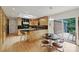 Open kitchen with skylight, modern appliances, breakfast bar, and eat-in dining area at 2600 Cloister Dr, Charlotte, NC 28211