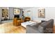 Inviting living room featuring a cozy fireplace, hardwood floors, and ample seating at 2600 Cloister Dr, Charlotte, NC 28211