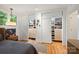 Bedroom with hardwood floors, view to closets, and large windows at 2600 Cloister Dr, Charlotte, NC 28211