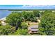Spacious property surrounded by lush, mature trees overlooking a serene lake at 29049 Snapper Pt, Tega Cay, SC 29708