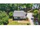 Aerial view of a charming two-story home with landscaped yard and lakeside driveway at 29049 Snapper Pt, Tega Cay, SC 29708