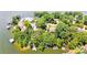 Picturesque aerial view of a lakeside neighborhood with homes nestled among mature trees and private docks at 29049 Snapper Pt, Tega Cay, SC 29708