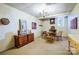 A finished basement area furnished with a chess table, a dresser and a window with outside light at 29049 Snapper Pt, Tega Cay, SC 29708
