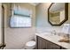 A well-lit bathroom featuring white subway tile and a modern vanity at 29049 Snapper Pt, Tega Cay, SC 29708
