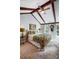 This bedroom has natural light, wooden beams, and a charming brass bed frame at 29049 Snapper Pt, Tega Cay, SC 29708