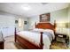 Bedroom featuring a wooden bed frame, and neutral wall color, leading to the bathroom at 29049 Snapper Pt, Tega Cay, SC 29708