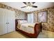 A charming bedroom with floral wallpaper, a ceiling fan, and ample natural light at 29049 Snapper Pt, Tega Cay, SC 29708