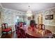 Formal dining room with a stunning crystal chandelier and ornate furniture at 29049 Snapper Pt, Tega Cay, SC 29708