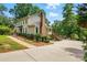 Charming home boasts a well-manicured lawn and ample parking at 29049 Snapper Pt, Tega Cay, SC 29708