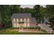 Charming two-story traditional home featuring a landscaped front yard and covered front porch at 29049 Snapper Pt, Tega Cay, SC 29708