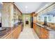 A beautiful kitchen featuring light wood cabinets and a tile backsplash at 29049 Snapper Pt, Tega Cay, SC 29708
