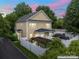 Backyard with white privacy fence, black metal roof, pergola, and lush green landscaping at 3007 Colonel Springs Way, Fort Mill, SC 29708