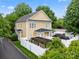 Backyard with white privacy fence, black metal roof, pergola, and lush green landscaping at 3007 Colonel Springs Way, Fort Mill, SC 29708