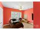 Bedroom with red walls, a ceiling fan, and closet at 3007 Colonel Springs Way, Fort Mill, SC 29708