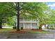Inviting two-story house with a spacious porch and well-maintained front yard at 3007 Colonel Springs Way, Fort Mill, SC 29708