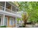 Charming two-story home with a inviting porch and lush green landscaping at 3007 Colonel Springs Way, Fort Mill, SC 29708