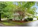 Charming two-story home with a inviting front porch and lush green landscaping at 3007 Colonel Springs Way, Fort Mill, SC 29708