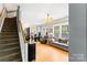 Bright and airy living space with hardwood floors and convenient staircase access at 3007 Colonel Springs Way, Fort Mill, SC 29708