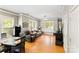 Open-concept living room with hardwood floors, neutral walls, and ample seating at 3007 Colonel Springs Way, Fort Mill, SC 29708